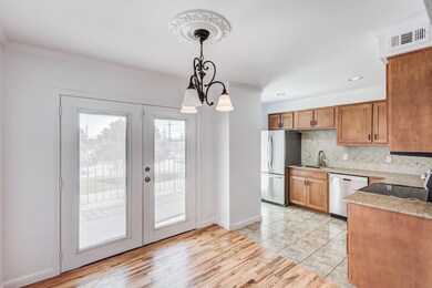 Kitchen with french doors, appliances with stainle