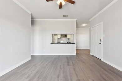 Unfurnished living room with wood finished floors