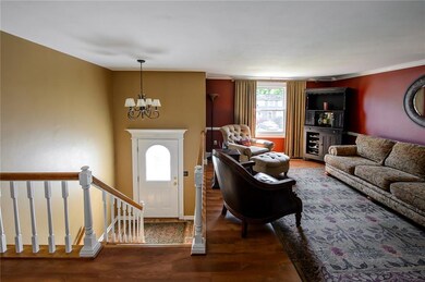 Front Entrance is open to main living room area. Upgraded flooring and fixtures throughout the home.