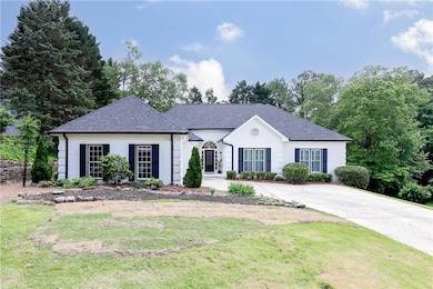 View of front of home featuring a front lawn, roof