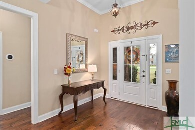 Foyer Entrance ~ Wood Flooring ~ Crown Molding