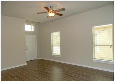 Unfurnished room with dark wood finished floors a