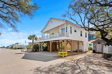 View of front of home with driveway, covered porch