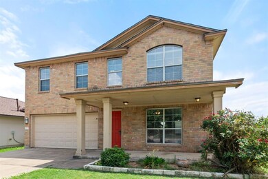 Traditional-style house featuring an attached gar