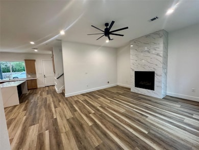 Unfurnished living room with wood finished floors