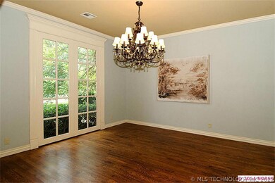 THE FORMAL DINING ROOM ALSO FEATURES HARDWOODS & F