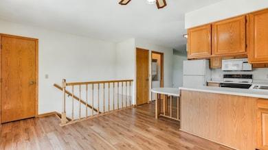 KITCHEN/DINING AREA - LAUNDRY CLOSET - STAIRWAY TO
