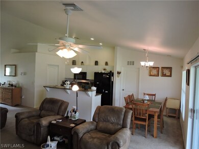 Open family room view of kitchen and dining area