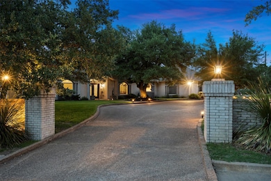 Obstructed view of property with curved driveway 
