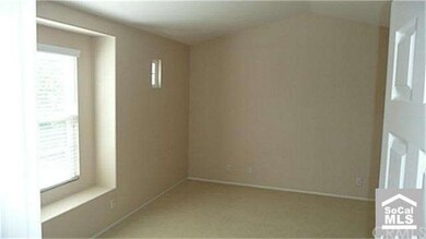 Master bedroom has vaulted ceilings and walk-in cl