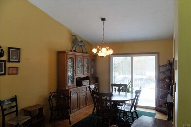 Dining area with newer sliders that go out to deck