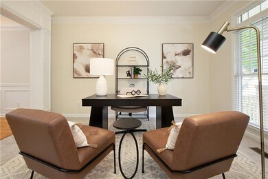 Versatile formal sitting room or office space just off the foyer.