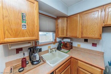 Kitchen featuring sink and backsplash