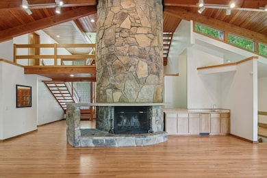 The Round Fireplace is the spine of this multi-lev