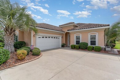 Mediterranean / spanish-style house featuring a ga