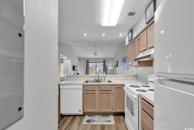 Kitchen with ceiling fan, sink, light hardwood / w