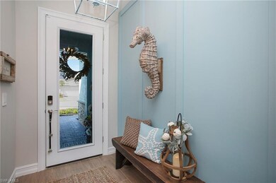 Entry way with upgraded glass door and custom wall