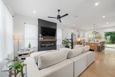 Living area featuring finished concrete floors, r