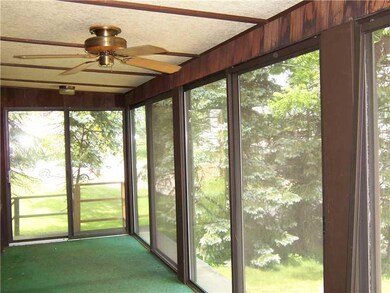 Patio/Deck. Screened porch off front of home.