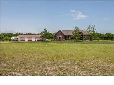 Home and outbuilding situated on 4.61 acres.