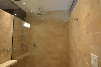 Bathroom featuring tiled shower