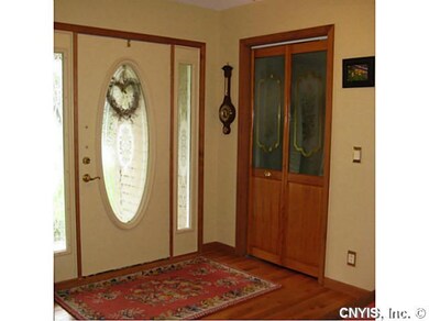 Foyer. Hardwoods, updated lighting and leaded glas