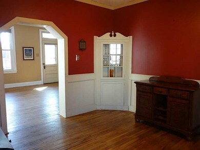 Exterior Front. Colonial corner cabinet in the din