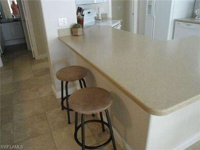 Convenient breakfast bar in kitchen.