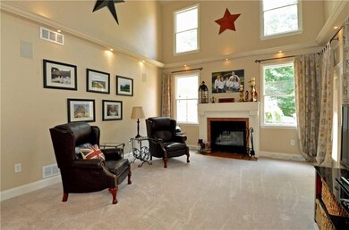 The family room is flooded with natural sunlight f