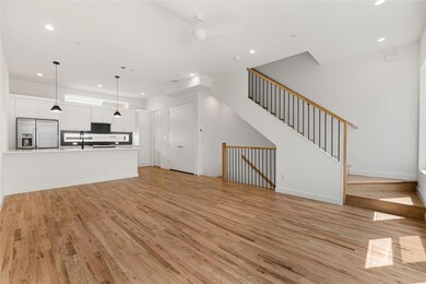 Unfurnished living room featuring light hardwood /