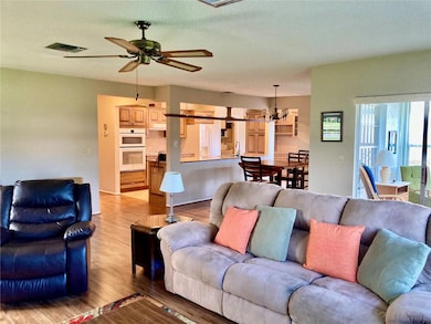 Open to dining room and kitchen.