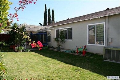 BACK YARD WITH COVERED PATIO