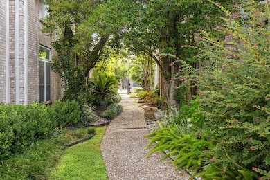 Your new home awaits at the end of a serene shaded and landscaped walkway, directly on your right.