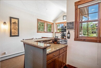 Kitchen featuring light stone counters, kitchen pe