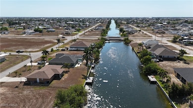 Aerial view with a water view and a residential vi