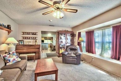 ...open to the kitchen with views of your front ya