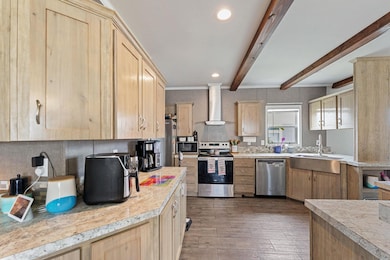 Kitchen featuring appliances with stainless steel