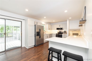 Kitchen featuring stainless steel appliances, a pe