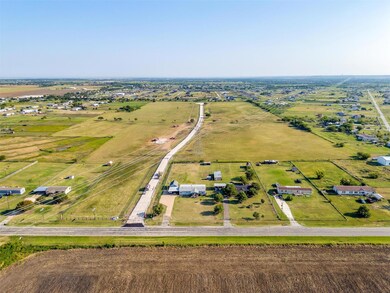 Birds eye view of property featuring a rural view