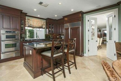 Kitchen with high end appliances and bar seating 