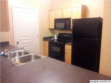 Kitchen with attached laundry room