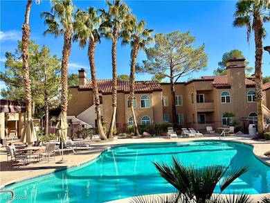 Community pool featuring a patio area