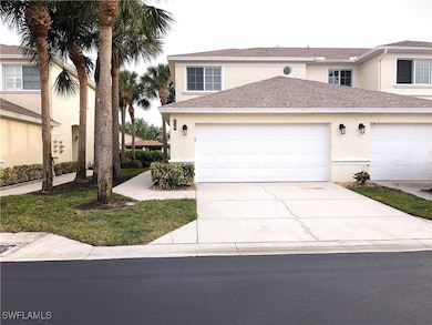 View of front of house with a garage, driveway, an
