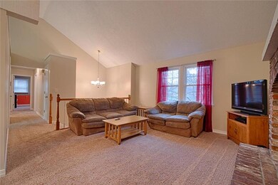 Open family room plan, vaulted ceiling. Brick fire