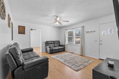 Living area featuring light wood-type flooring, ce