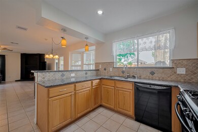 Light and bright kitchen is open to the breakfast