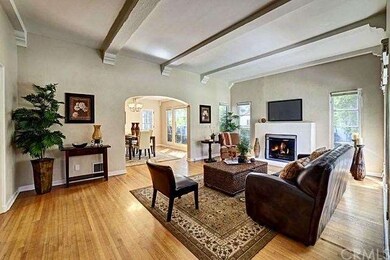Beautiful hardwood floors throughout, arched doorw