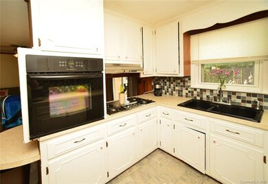 Kitchen includes gas range, electric oven, double 
