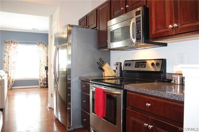 Stainless Steel appliances and hardwood floors in your kitchen!