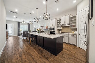This stunning, light-filled kitchen boasts warm to